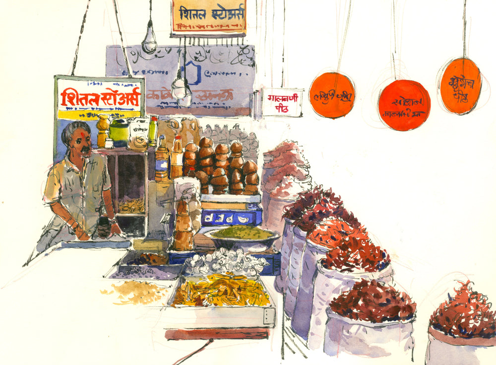 Indian man vendor selling pani puri snack on stall