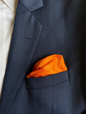 
                
                    Load image into Gallery viewer, Raw Silk Pocket Squares in White Ikat &amp;amp; Solid Orange - Set of 2
                
            