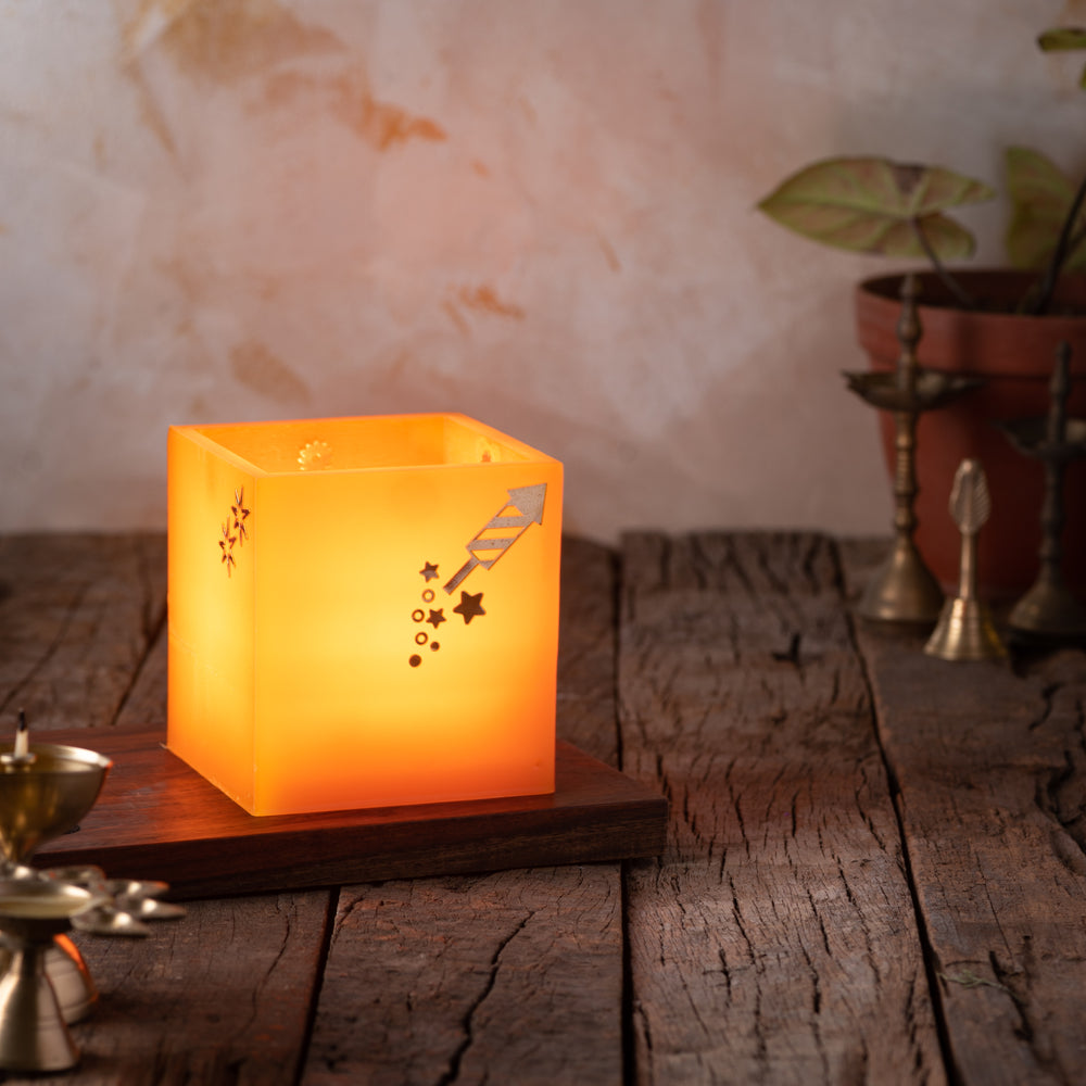 Orange Firecracker Hurricane Candle with jasmine-scented votive