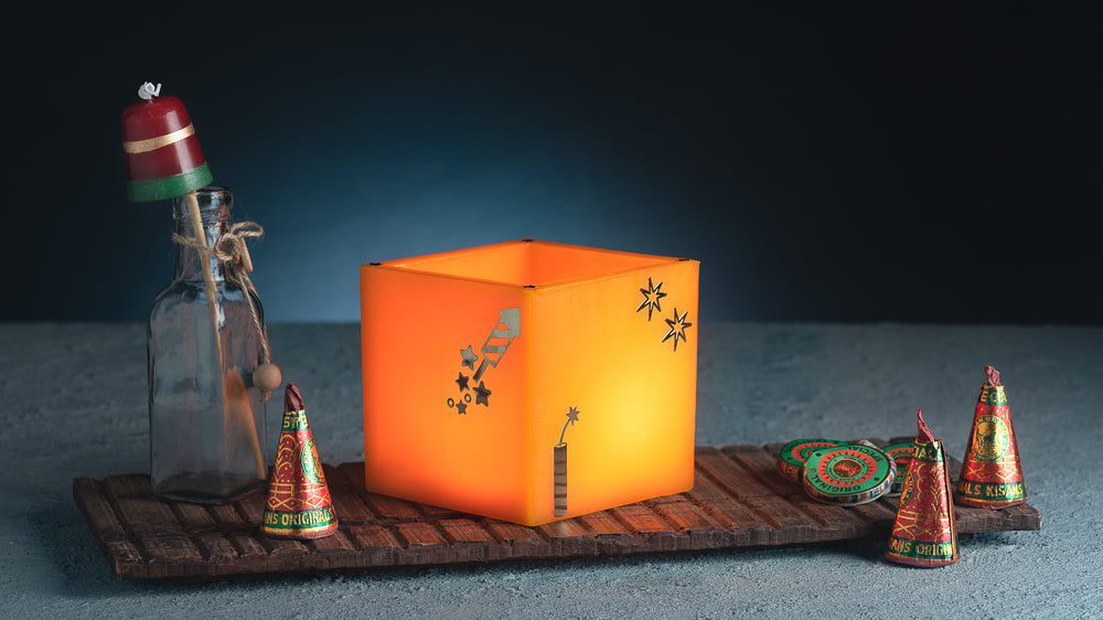 Orange Firecracker Hurricane Candle with jasmine-scented votive